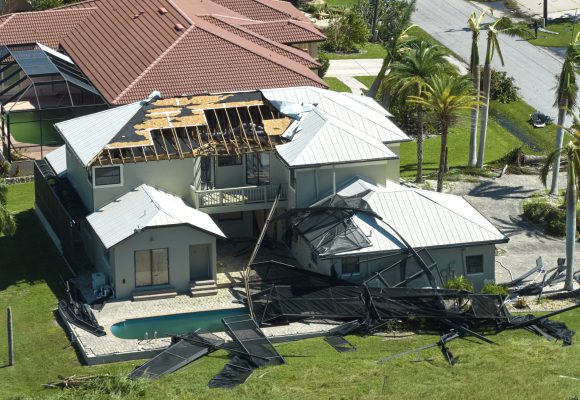 Hurricane Ian destroyed house in Florida residential area. Natural disaster and its consequences.